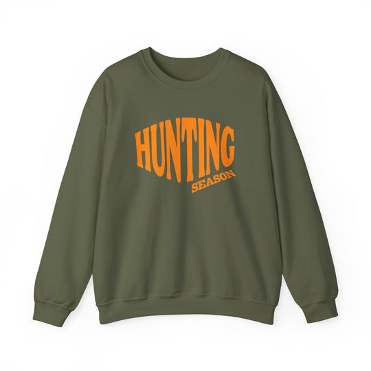Army-green sweatshirt with HUNTING SEASON in orange letters, crewneck, long sleeves, unisex fit. Made of a cozy polyester-cotton blend for comfort and durability.