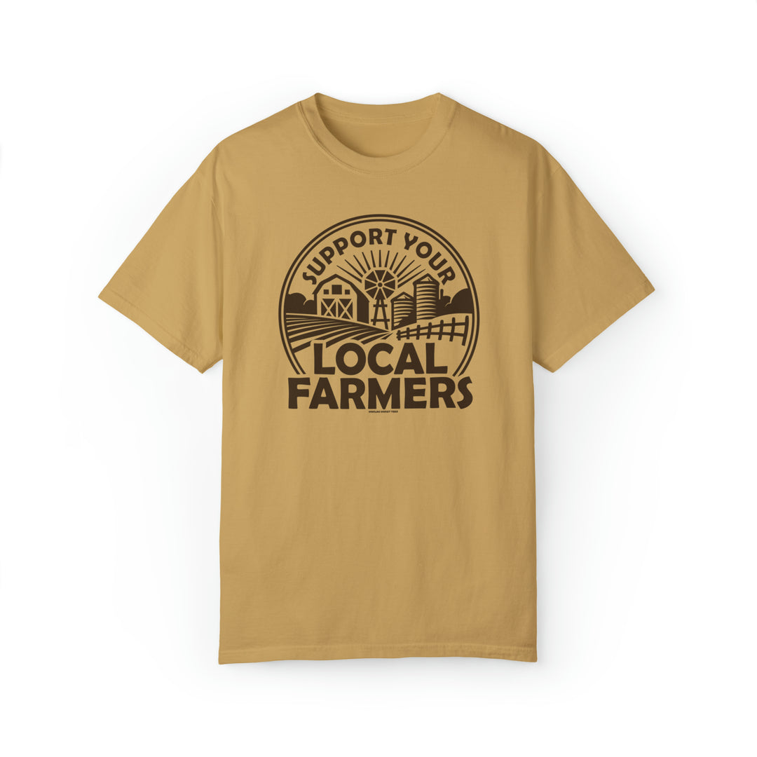 A tan t-shirt featuring a graphic design of a local farmers market logo. Unisex, garment-dyed sweatshirt made of 80% ring-spun cotton and 20% polyester. Relaxed fit with rolled-forward shoulder and back neck patch.