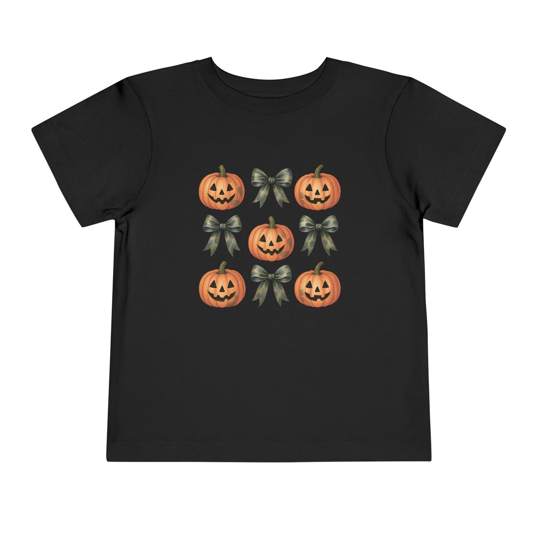 Pumpkins and Bows Toddler Tee features a 3x3 grid with smiling jack-o’-lanterns and ribbon bows, perfect for a comfy, custom kids' wardrobe staple.