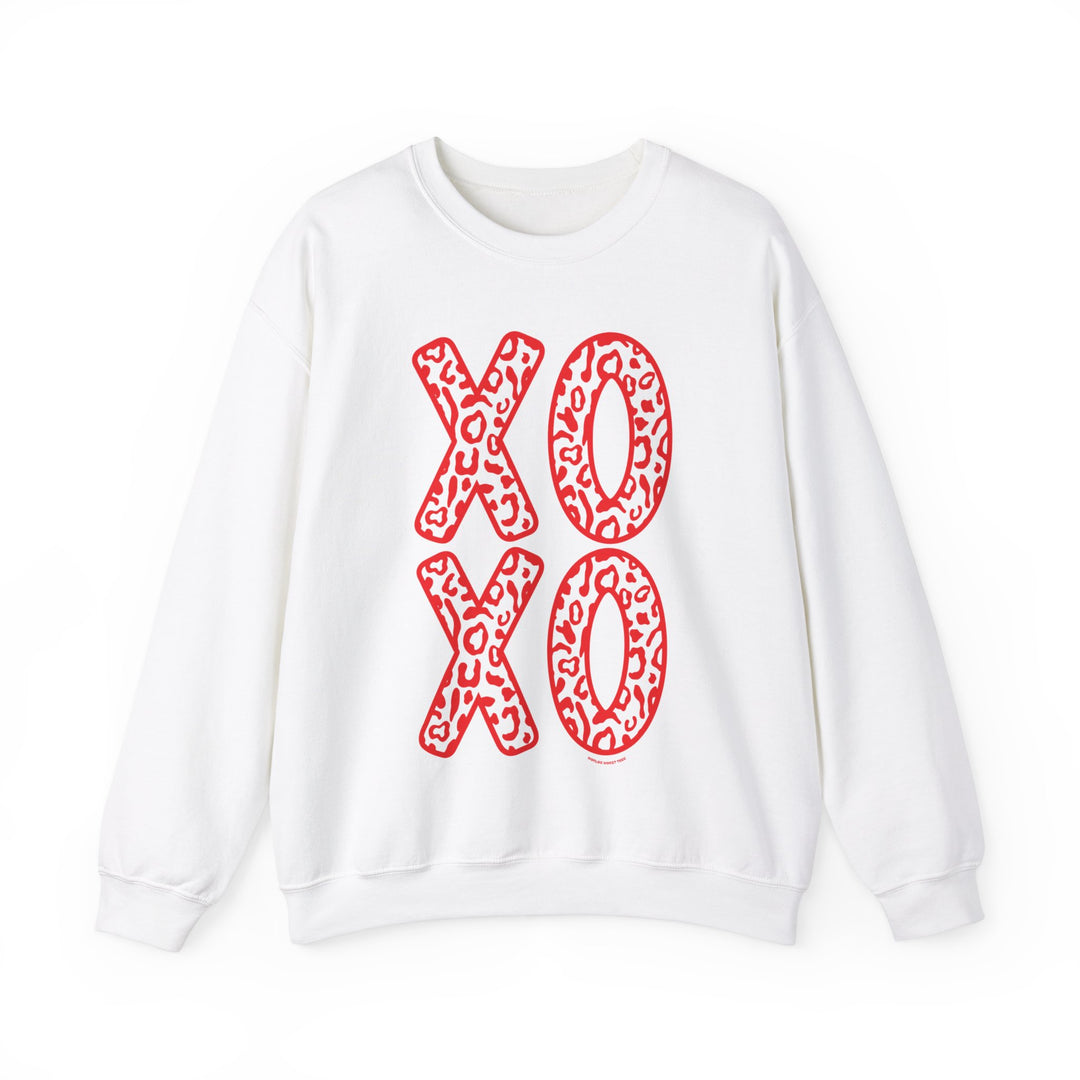 Unisex XOXO Crew heavy blend sweatshirt with red letters on white fabric. Comfortable, ribbed knit collar, no itchy seams. 50% cotton, 50% polyester, loose fit, sewn-in label. Ideal for all occasions.