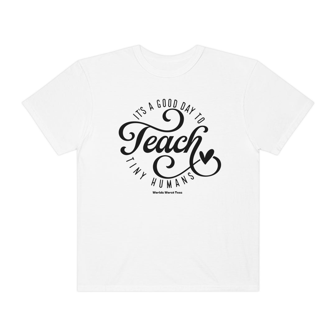 A relaxed-fit Teach Tiny Humans Tee in white with black text. Unisex garment-dyed sweatshirt made of 80% ring-spun cotton and 20% polyester. Luxurious comfort with rolled-forward shoulder and back neck patch.