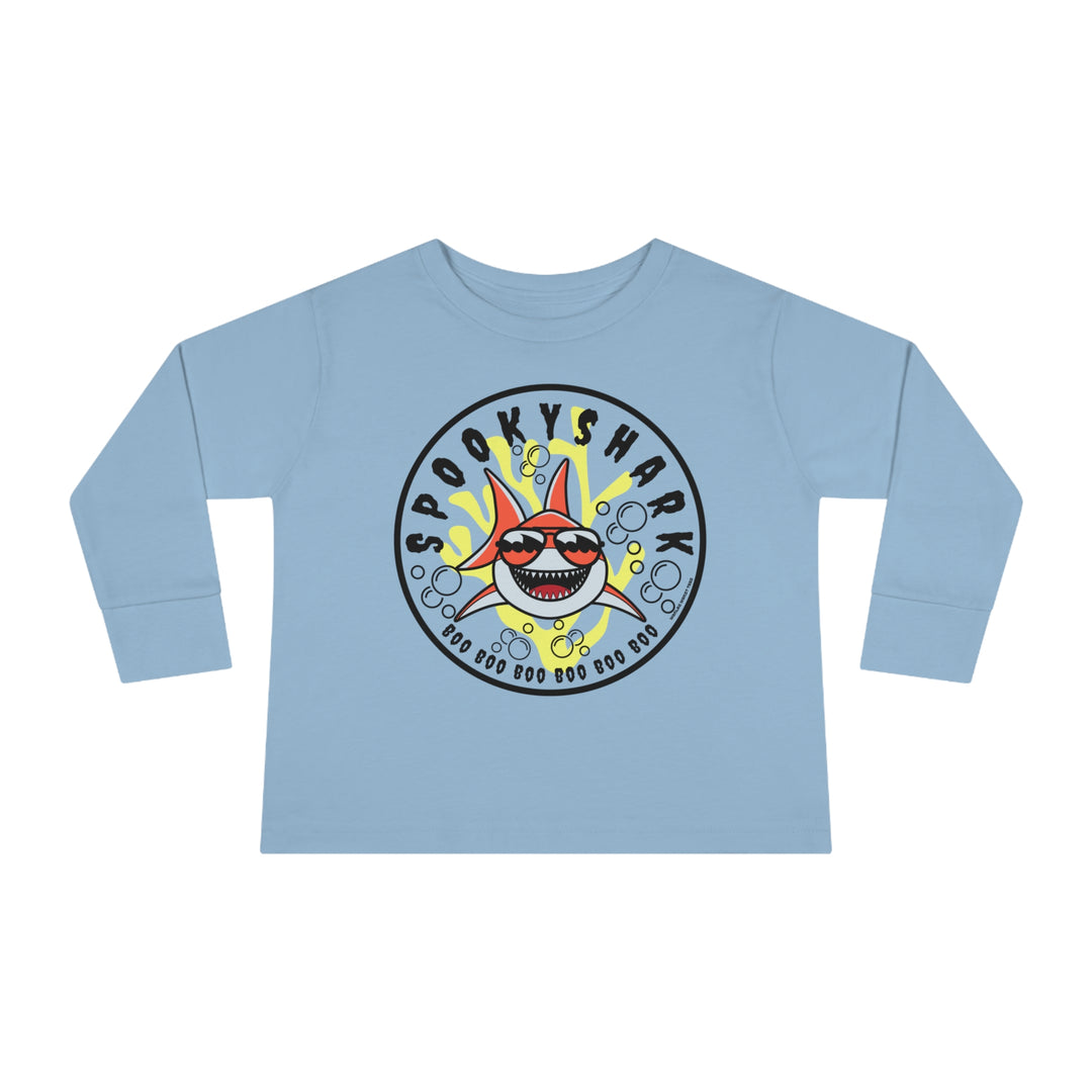 Spooky Shark Toddler Long Sleeve Tee featuring a cartoon shark with sunglasses on a blue shirt. Made of 100% combed ringspun cotton, with ribbed collar and EasyTear™ label for comfort and durability.