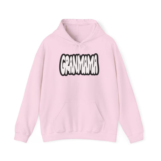 Granmama Hoodie: A pink unisex heavy blend hooded sweatshirt with white text. Made of 50% cotton, 50% polyester, featuring a kangaroo pocket and matching drawstring. Plush, warm, and stylish for cold days.