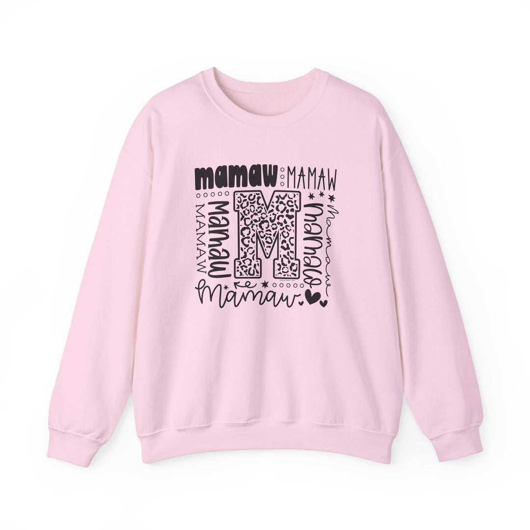 A cozy Mamaw Crew unisex sweatshirt in pink with a bold letter M design. Made from a comfy 50% cotton, 50% polyester blend, featuring a ribbed knit collar and durable double-needle stitching.