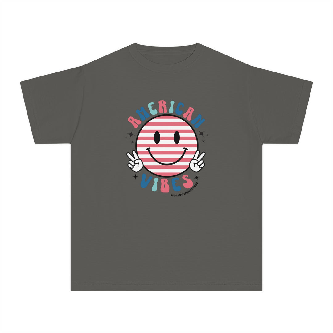 American Vibes Youth Tee: A grey t-shirt featuring a smiley face cartoon design, perfect for active kids. Made of soft-washed, 100% combed ringspun cotton for comfort and agility. Classic fit for all-day wear.