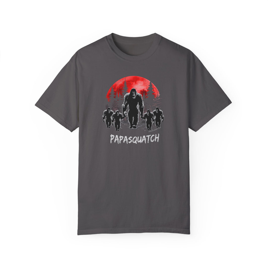 A ring-spun cotton Papasquatch Tee in grey, featuring a bigfoot design under a red moon. Garment-dyed for coziness, with a relaxed fit and durable double-needle stitching. Ideal for daily wear.