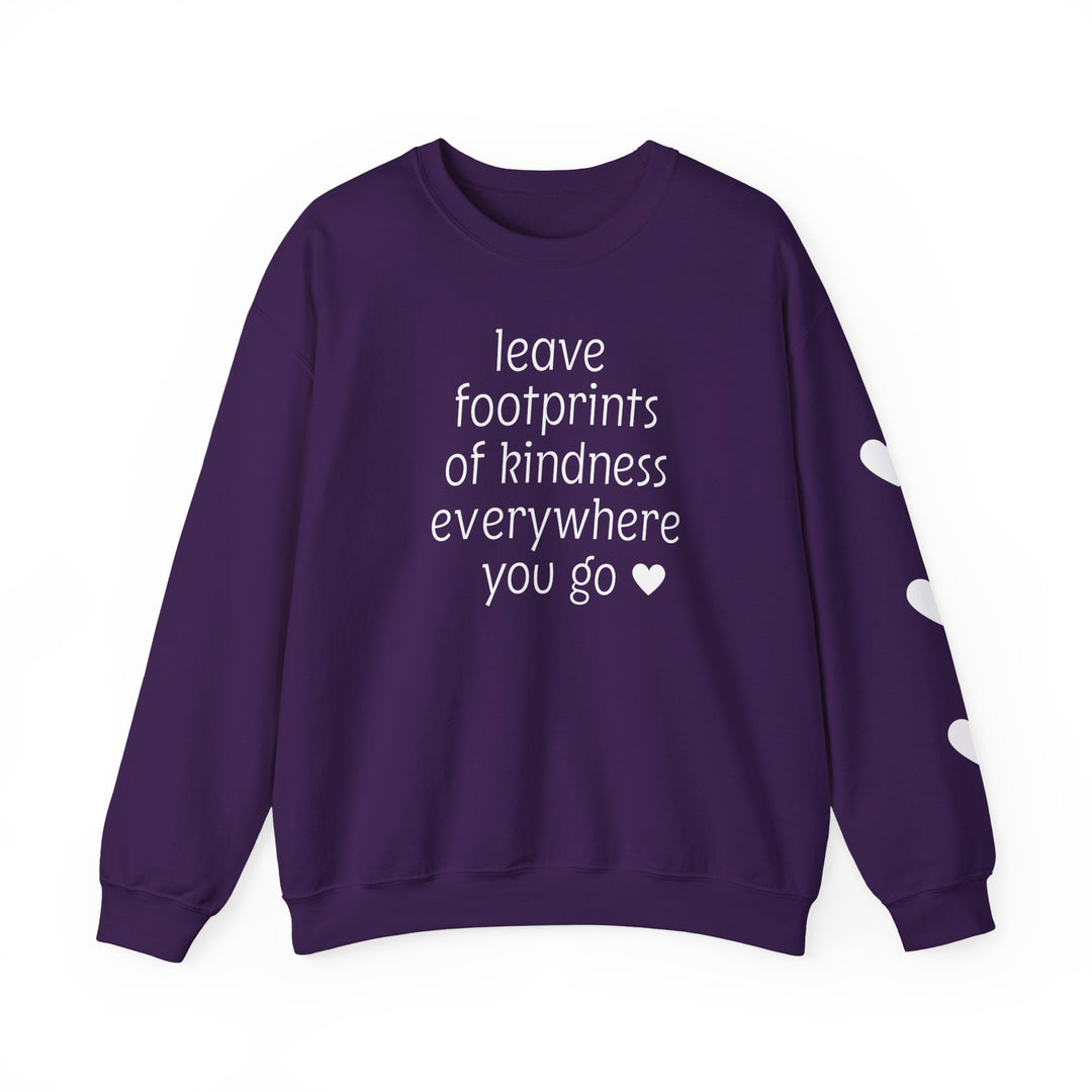 Purple crew-neck sweatshirt with white text: leave footprints of kindness everywhere you go ♥ and three white hearts on one sleeve.