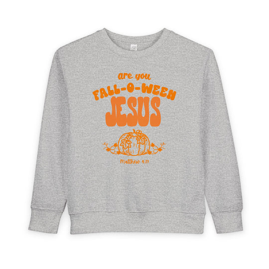 Light-gray toddler crewneck sweatshirt with are you FALL-O-WEEN JESUS in orange bubble letters, featuring a pumpkin illustration and Matthew 4:19 text below.
