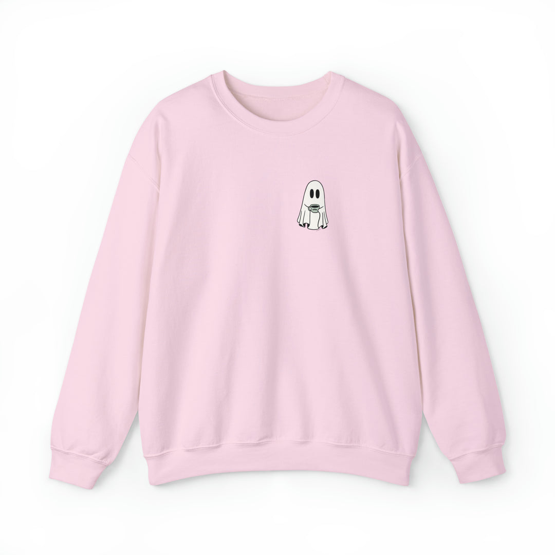 A pink sweatshirt featuring a cartoon ghost holding a coffee cup. Unisex heavy blend crewneck sweatshirt for pure comfort, made from 50% cotton, 50% polyester. Ribbed knit collar, loose fit, and no itchy side seams. Ideal for any situation.