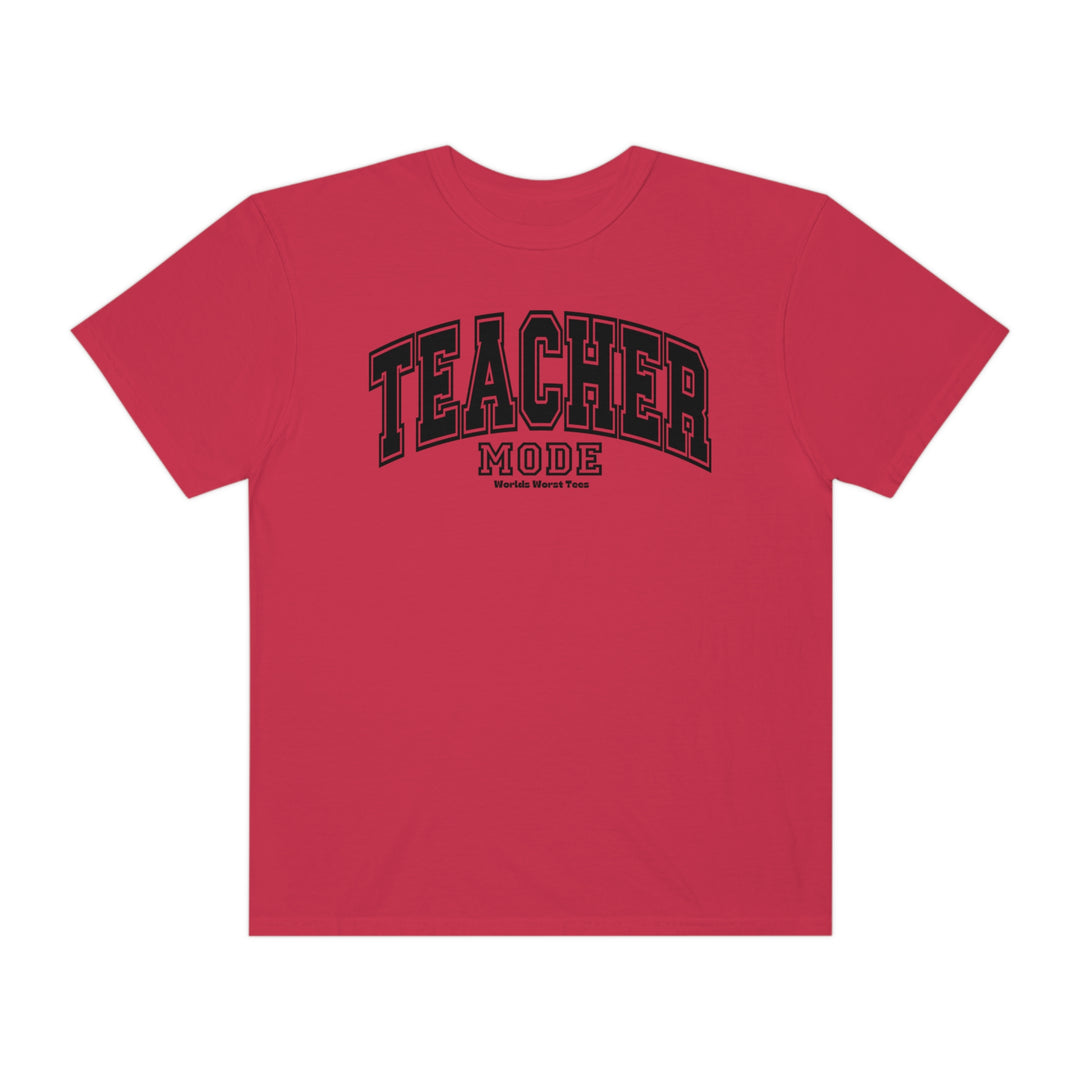 A red Teacher Mode Tee shirt with black text, made of 80% ring-spun cotton and 20% polyester. Unisex garment-dyed sweatshirt with a relaxed fit and rolled-forward shoulder.