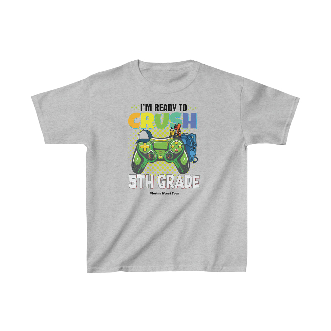 A grey kids tee featuring a cartoon character and a video game controller. Made of 100% cotton, light fabric, with a classic fit and tear-away label. Ideal for everyday wear.