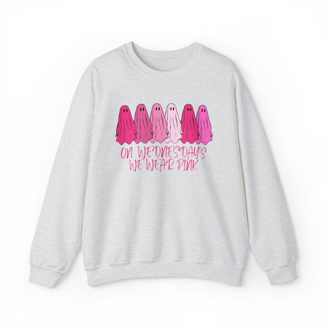 Unisex heavy blend crewneck sweatshirt featuring On Wednesday's We Wear Pink graphic. Comfortable 50% cotton, 50% polyester fabric with ribbed knit collar. Loose fit, sewn-in label, true to size.