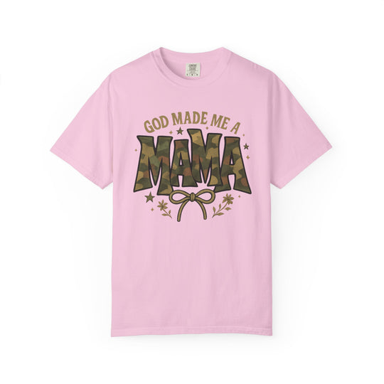 Light pink God Made Me a Mama tee, featuring camouflage MAMA graphic, bow illustration, floral and star accents, designed for comfort and style.