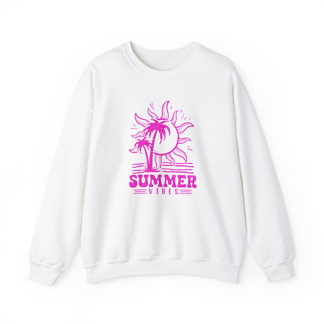 A white crewneck sweatshirt featuring a pink sun and palm tree graphics, embodying summer vibes. Unisex heavy blend fabric for comfort, ribbed knit collar, and no itchy seams. Perfect for casual wear.