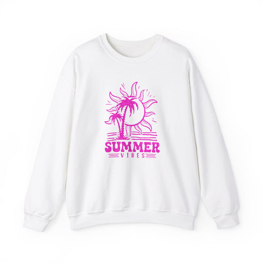 A white crewneck sweatshirt featuring a pink sun and palm tree graphics, embodying summer vibes. Unisex heavy blend fabric for comfort, ribbed knit collar, and no itchy seams. Perfect for casual wear.