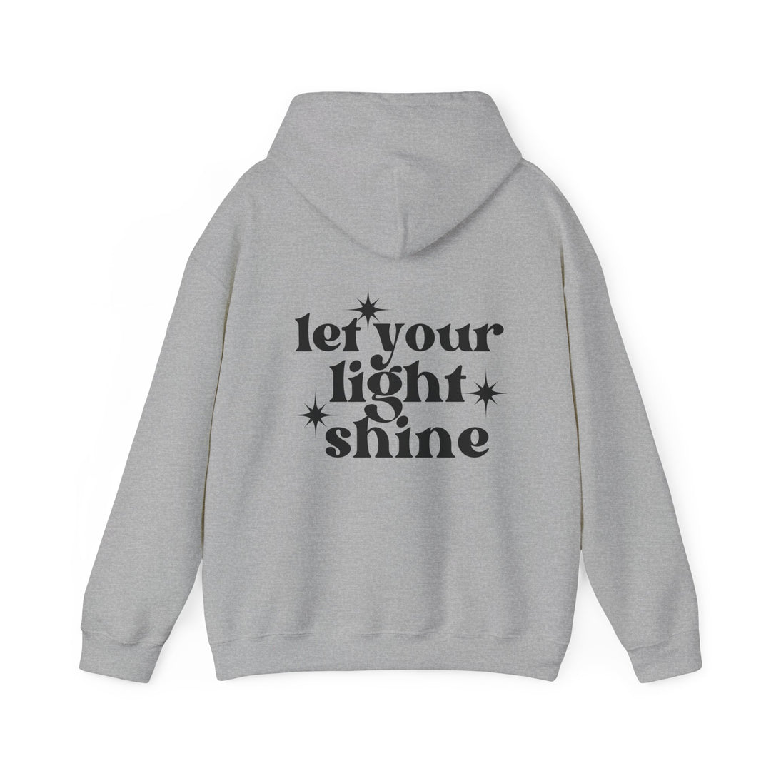 Unisex Let Your Light Shine Hoodie, a cozy blend of cotton and polyester. Features kangaroo pocket, color-matching drawstring, and tear-away label. Medium-heavy fabric, classic fit, sizes S-5XL. Ideal for cold days.