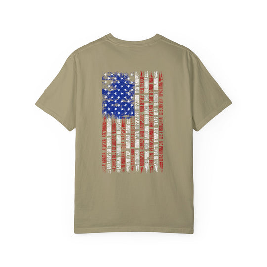 A tan State Flag Tee, garment-dyed with ring-spun cotton for cozy wear. Relaxed fit, double-needle stitching, and seamless design for durability and comfort. Represent your style with this unique graphic t-shirt.