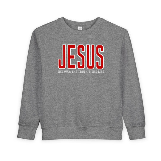 Heather-gray toddler crewneck sweatshirt featuring JESUS in bold red and THE WAY, THE TRUTH & THE LIFE in white. Cozy, durable, and CPSIA compliant.