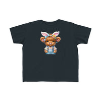 Easter Cow Toddler Tee: A black t-shirt featuring a cartoon cow in bunny ears, perfect for sensitive skin. Made of 100% combed ringspun cotton, light fabric, classic fit, tear-away label, and true-to-size.