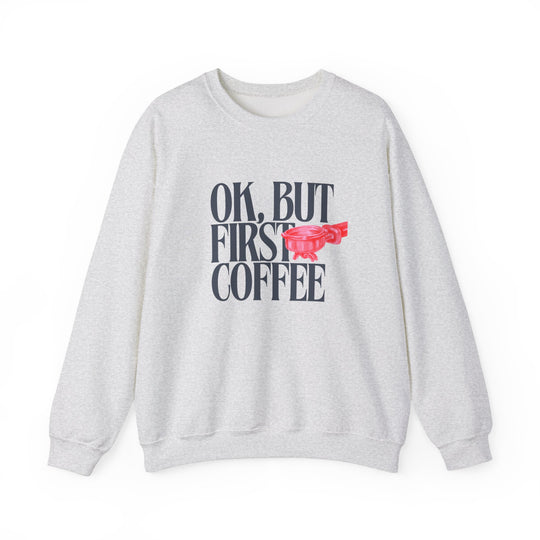 Ok But First Coffee Crew sweatshirt, unisex, ribbed knit collar, medium-heavy blend, designed for comfort and durability, suitable for colder months. Ideal for casual, cozy wear.