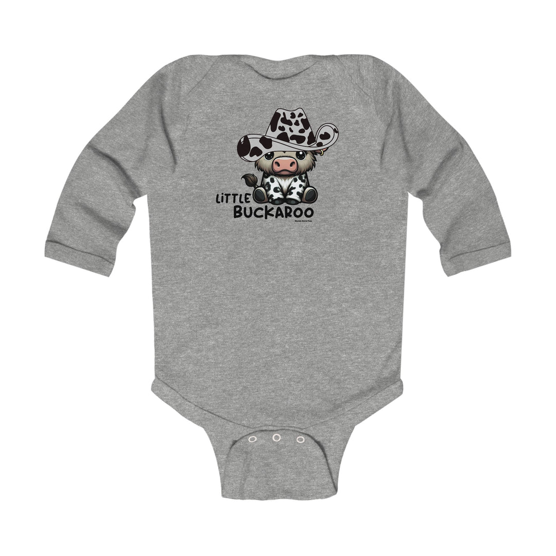 A grey baby bodysuit featuring a cow and cowboy hat cartoon design. Infant long sleeve onesie for durability and comfort. Made of 100% cotton for softness. Plastic snaps for easy changing. From Worlds Worst Tees.