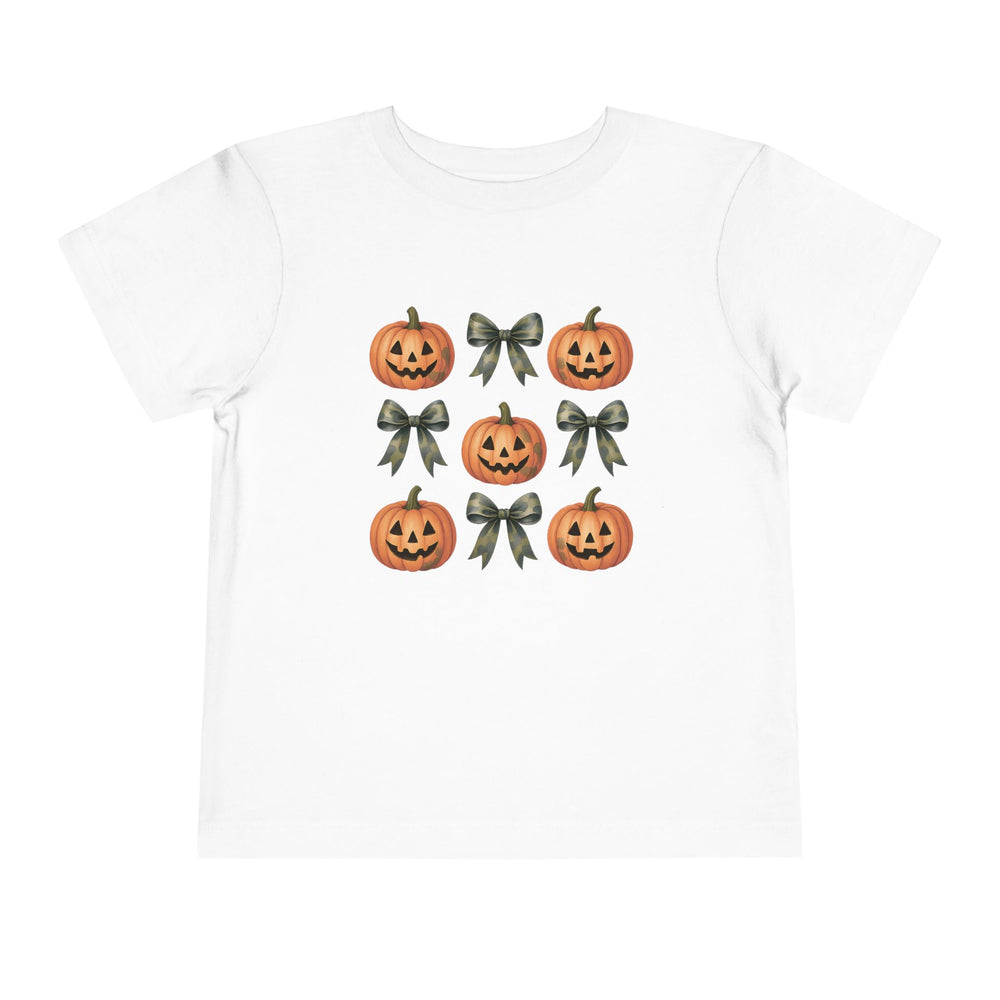 Pumpkins and Bows Toddler Tee featuring a 3×3 grid of jack-o’-lanterns and ribbon bows, perfect for Halloween-themed, comfortable wear. Made of 100% Airlume cotton.