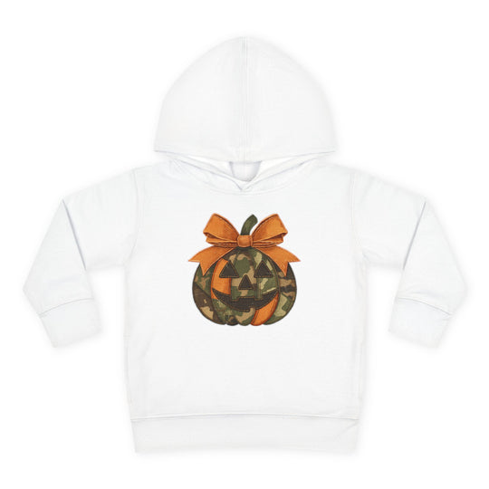 Jackie O Toddler Hoodie features a Halloween-themed jack-o’-lantern applique with orange and camouflage segments, a smiling face, and an orange bow on a white hoodie.