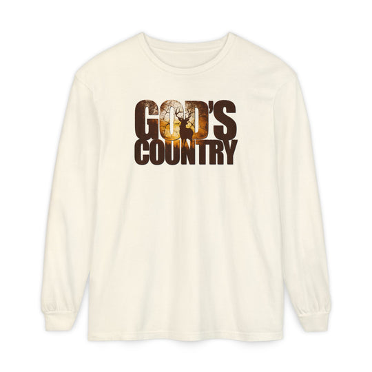 God's Country Long Sleeve Tee in cream with distressed GOD'S COUNTRY print featuring a stag silhouette and sunset scene. Made from 100% ring-spun cotton for comfort.