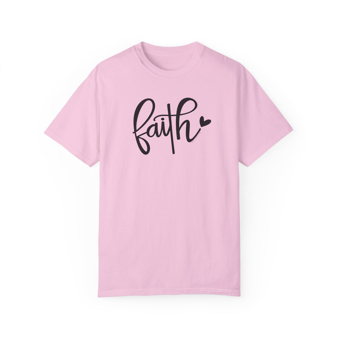 A pink Faith Tee, garment-dyed with ring-spun cotton for coziness. Relaxed fit, double-needle stitching, no side-seams for durability and shape retention. Ideal for daily wear.