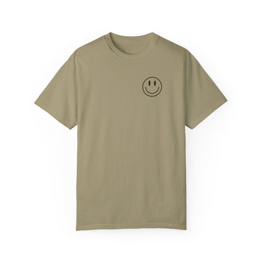 A tan Be the reason Tee t-shirt with a smiley face graphic. 100% ring-spun cotton, garment-dyed for extra coziness. Relaxed fit, double-needle stitching for durability. From Worlds Worst Tees.