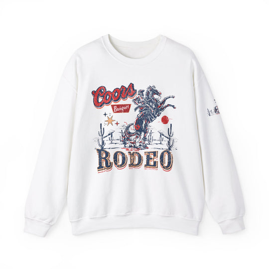 A white sweatshirt featuring a horse graphic, ideal for comfort in any situation. Unisex heavy blend crewneck with ribbed knit collar, polyester-cotton fabric, and no itchy side seams. Product title: Coors Rodeo Crew.