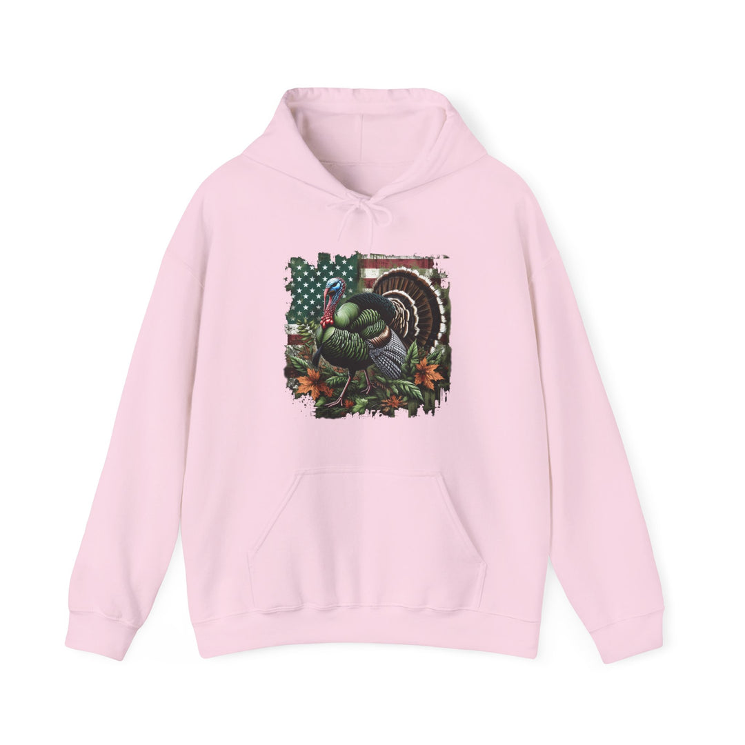 A pink hoodie featuring a turkey design, ideal for turkey hunting enthusiasts. Unisex heavy blend with cotton and polyester, kangaroo pocket, and drawstring hood. Classic fit, tear-away label, medium-heavy fabric.