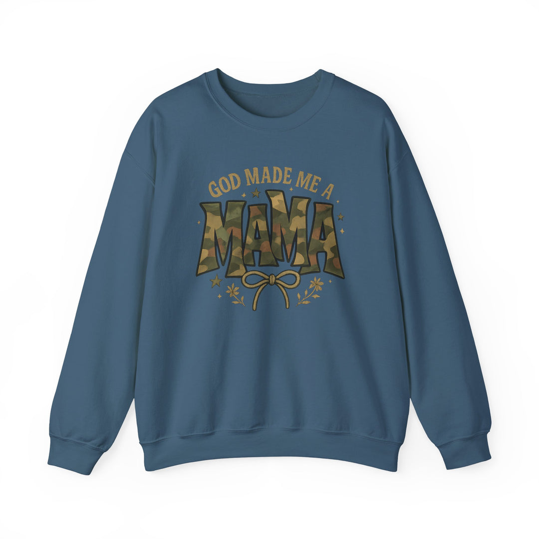 Blue crewneck sweatshirt with GOD MADE ME A MAMA graphic featuring camouflage-patterned MAMA, bow, foliage, and stars. Made from a cozy cotton-polyester blend.