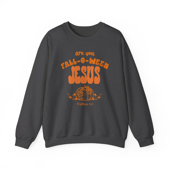 Dark charcoal-gray crewneck sweatshirt with Halloween-themed faith pun, FALL-O-WEEN JESUS, above a pumpkin illustration. Scripture reference Matthew 4:19 below the graphic.