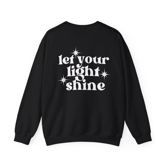 Unisex Let Your Light Shine Crew sweatshirt: Black with white text and star logo. Comfortable blend of polyester and cotton, ribbed knit collar, no itchy seams. Sizes S-5XL. Ideal for all occasions.