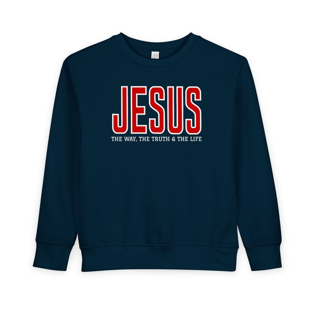 Navy-blue toddler sweatshirt with JESUS in red and THE WAY, THE TRUTH & THE LIFE beneath, highlighting faith-inspired design and cozy fabric.