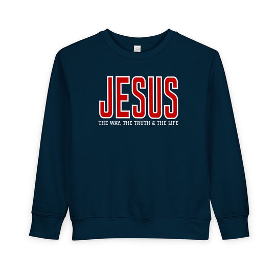 Navy-blue toddler sweatshirt with JESUS in red and THE WAY, THE TRUTH & THE LIFE beneath, highlighting faith-inspired design and cozy fabric.