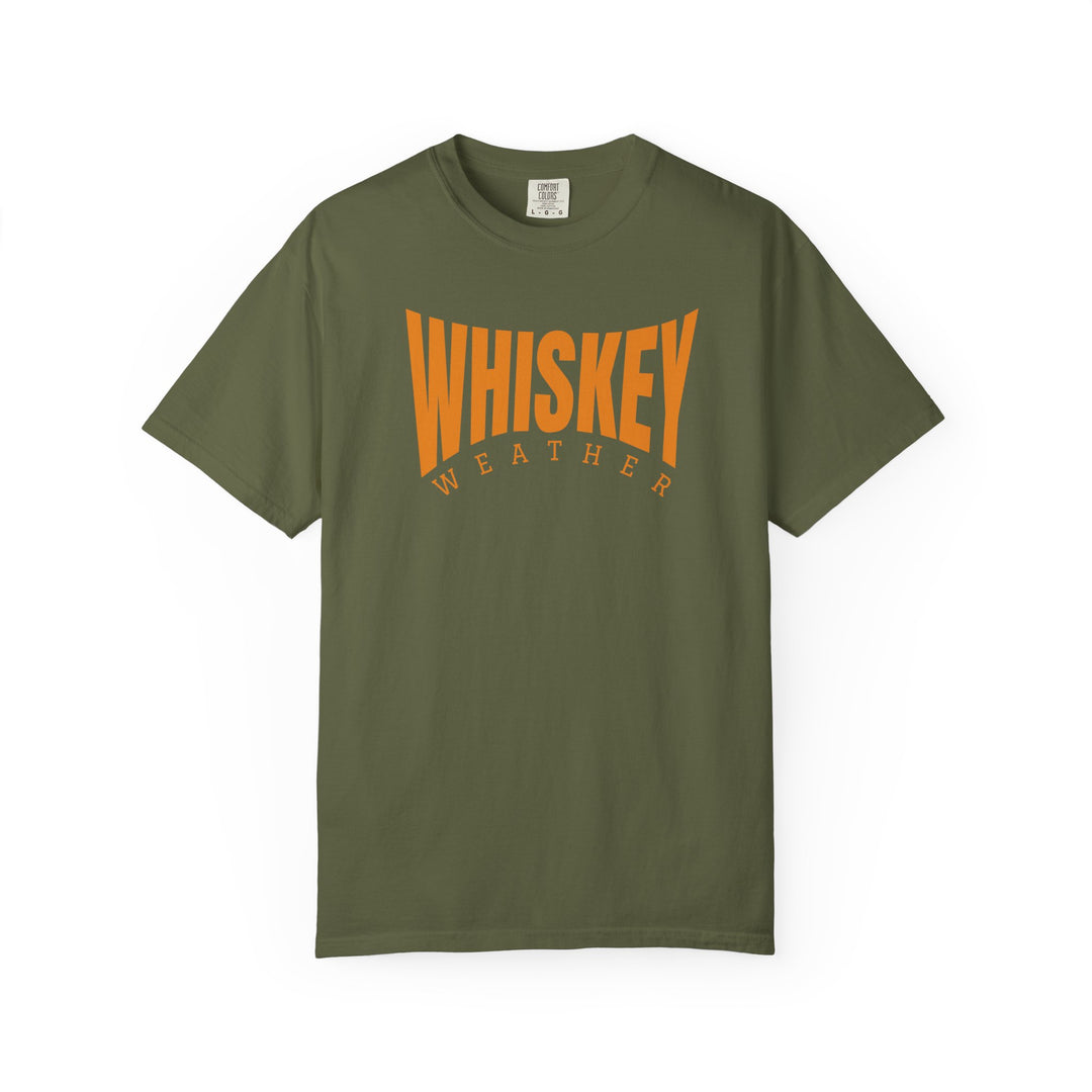 Olive-green Whiskey Weather Tee with bold orange lettering, showcasing relaxed fit and durable stitching, perfect for everyday wear.