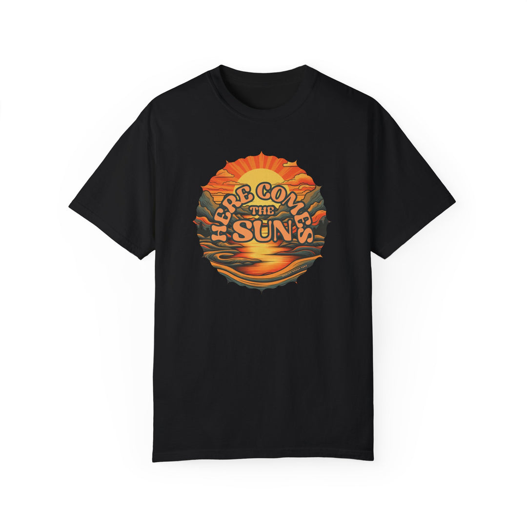 A relaxed-fit, garment-dyed Here Comes The Sun Tee in black, featuring a graphic design on ring-spun cotton. Double-needle stitching for durability, no side-seams for a tubular shape. Ideal for daily wear.