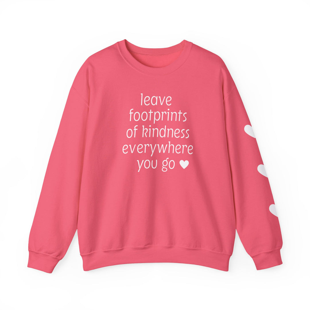 Coral-pink crewneck sweatshirt with leave footprints of kindness everywhere you go ♥ in white on front; three white hearts on right sleeve.