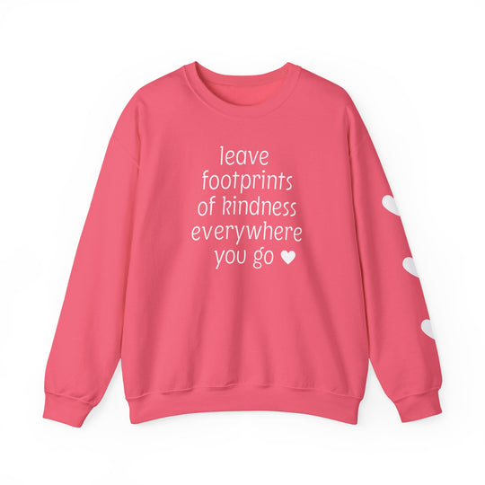 Coral-pink crewneck sweatshirt with leave footprints of kindness everywhere you go ♥ in white on front; three white hearts on right sleeve.