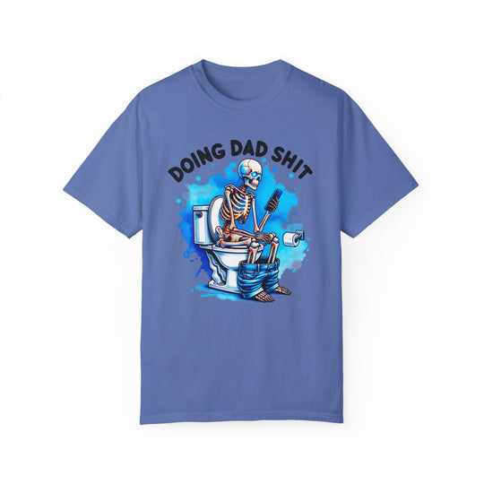 A relaxed fit Doing Dad Shit Tee in blue, featuring a skeleton design on a toilet. Made of 100% ring-spun cotton for comfort and durability, perfect for daily wear.