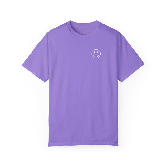 Be the reason Tee: Purple t-shirt with a smiley face design. 100% ring-spun cotton, garment-dyed for extra coziness. Relaxed fit, double-needle stitching for durability, no side-seams for a tubular shape.