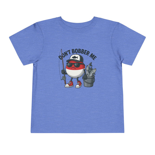Don't Bobber Me Toddler Tee: Cartoon fishing bobber with sunglasses and fishing gear on heather-blue T-shirt, ideal for playful, everyday wear by toddlers.