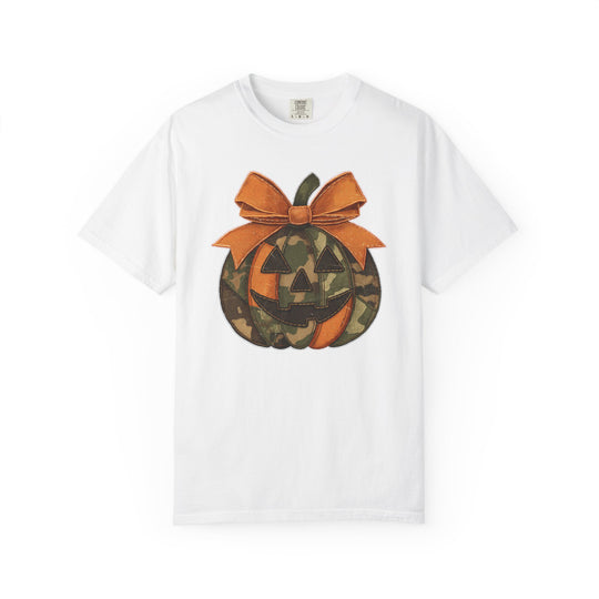 Jackie O Tee featuring a jack-o-lantern graphic with alternating orange and camo segments, topped with an oversized bow, on a white short-sleeve T-shirt.