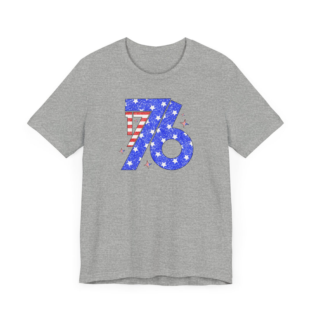 A grey 1776 Tee with stars, stripes, and a number, a classic unisex jersey shirt made of 100% Airlume combed cotton. Retail fit, tear away label, and ribbed knit collars for a comfortable, lasting fit.