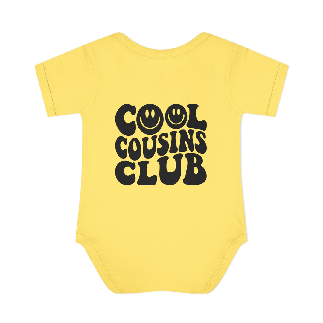 Infant unisex Cool Cousins Club onesie, featuring lap shoulders and a soft, 100% ring-spun cotton fabric for comfort. Ideal for easy dressing.