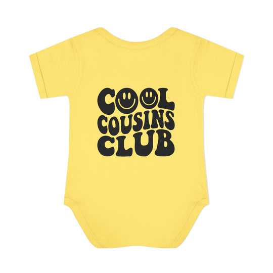 Infant unisex Cool Cousins Club onesie, featuring lap shoulders and a soft, 100% ring-spun cotton fabric for comfort. Ideal for easy dressing.