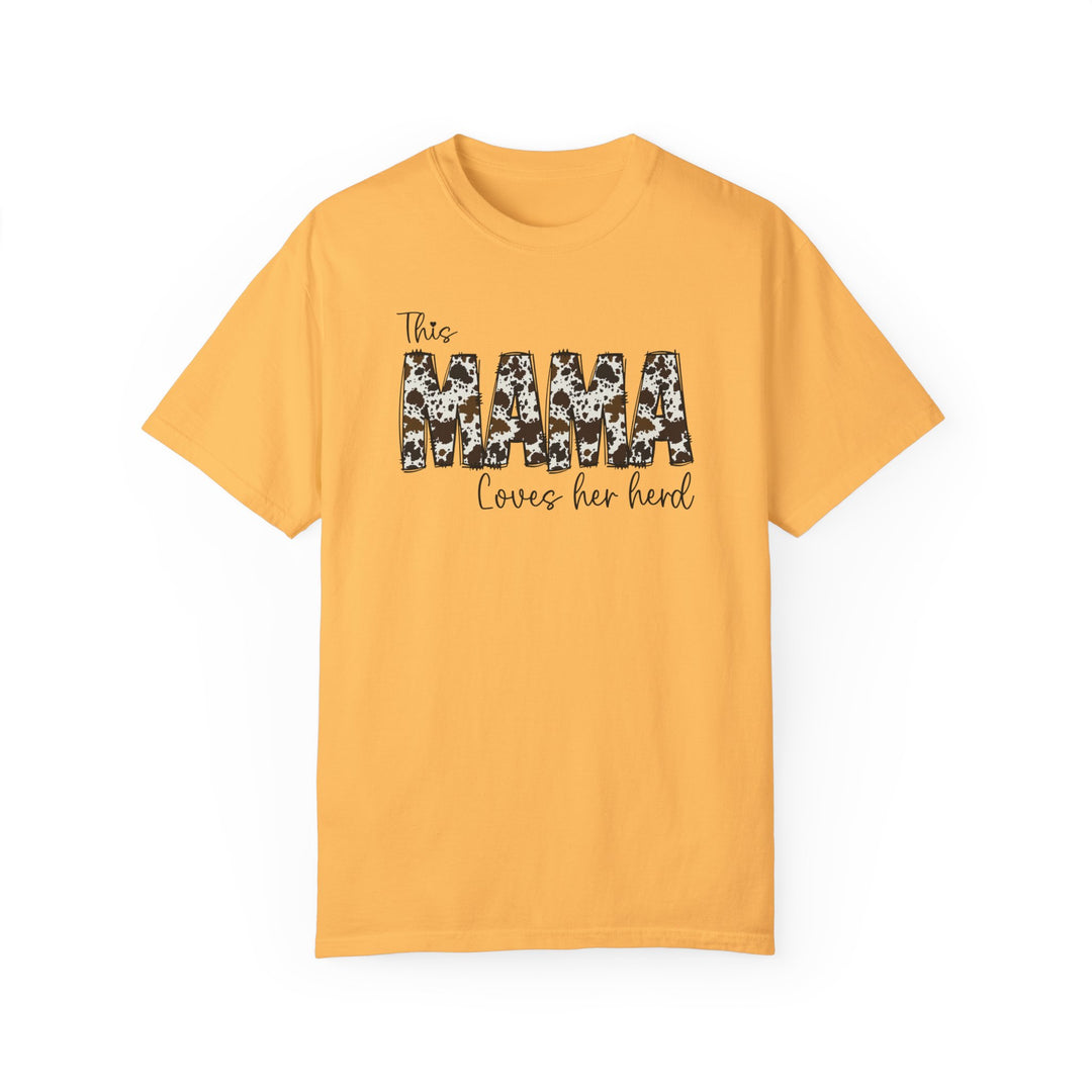 A relaxed fit Mama Herd Tee in yellow with black text. 100% ring-spun cotton, garment-dyed for coziness. Double-needle stitching for durability, no side-seams for a tubular shape. Sizes: S-4XL.