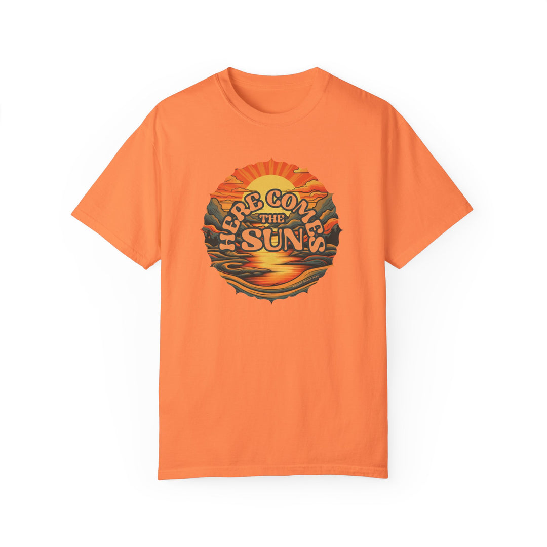 An orange tee with a graphic design featuring a sunset and mountains. Made of 100% ring-spun cotton, medium weight, and relaxed fit for daily comfort. Durable double-needle stitching, no side-seams for shape retention.